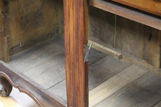 A late 18th century French provincial fruitwood side cabinet, W.138cm D.52.5cm H.94.5cm